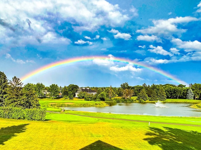 3877 Fairway Dr, Woodbury, MN 55125 - view of property's community featuring a water view, view of golf course, a lawn, and view of wooded area