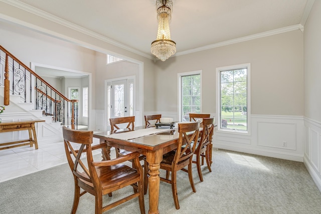 3877 Fairway Dr, Woodbury, MN 55125 - dining area with light carpet, crown molding, a chandelier, stairway, and a wainscoted wall