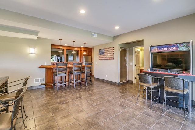 3877 Fairway Dr, Woodbury, MN 55125 - indoor dry bar featuring baseboards, recessed lighting, hanging light fixtures, and freestanding refrigerator
