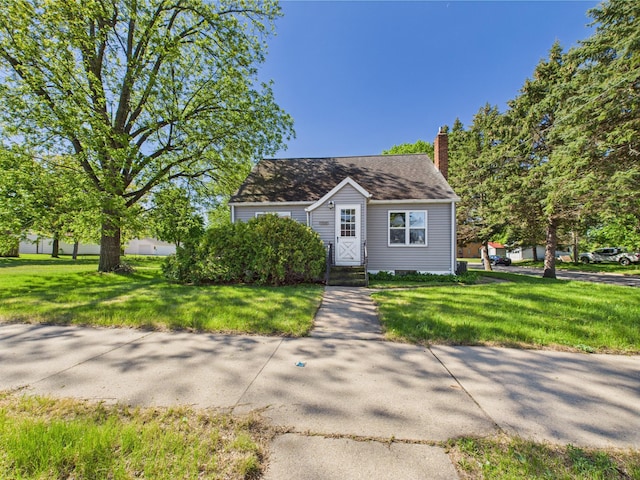 302 2nd St S, Melrose, MN 56352 - bungalow with a front lawn and a chimney