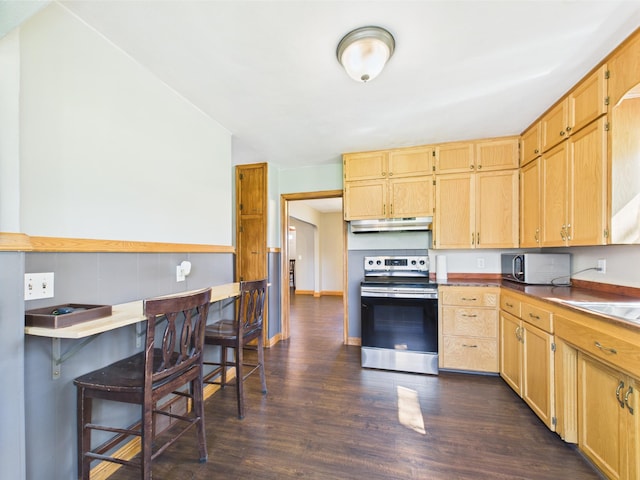 302 2nd St S, Melrose, MN 56352 - kitchen featuring stainless steel appliances, under cabinet range hood, dark wood-style flooring, a breakfast bar, and light brown cabinets
