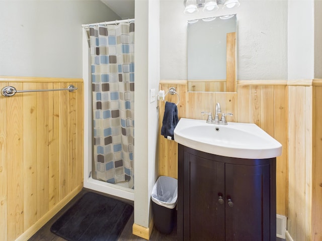 302 2nd St S, Melrose, MN 56352 - full bathroom featuring a wainscoted wall, vanity, and a shower with curtain