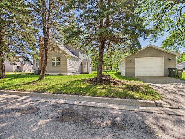 302 2nd St S, Melrose, MN 56352 - view of front of property featuring an outbuilding, a front lawn, a detached garage, cooling unit, and driveway