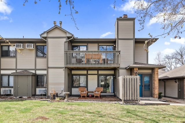445 Shelard Pkwy Unit 204, Saint Louis Park, MN 55426 - back of house with a balcony, a yard, and a chimney