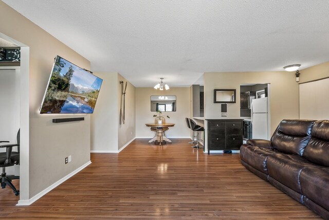 445 Shelard Pkwy Unit 204, Saint Louis Park, MN 55426 - living room with wood finished floors, a textured ceiling, baseboards, and an office area