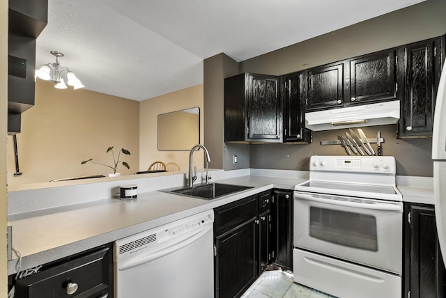 445 Shelard Pkwy Unit 204, Saint Louis Park, MN 55426 - kitchen featuring white appliances, dark cabinetry, under cabinet range hood, a sink, and light countertops