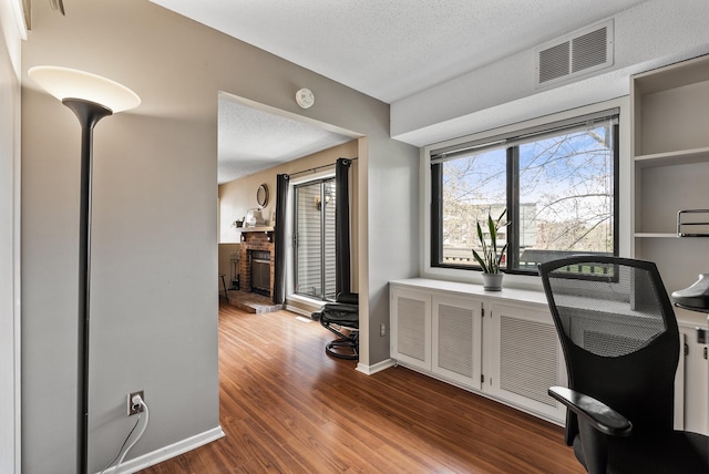 445 Shelard Pkwy Unit 204, Saint Louis Park, MN 55426 - office area featuring dark wood-style flooring, a textured ceiling, and baseboards