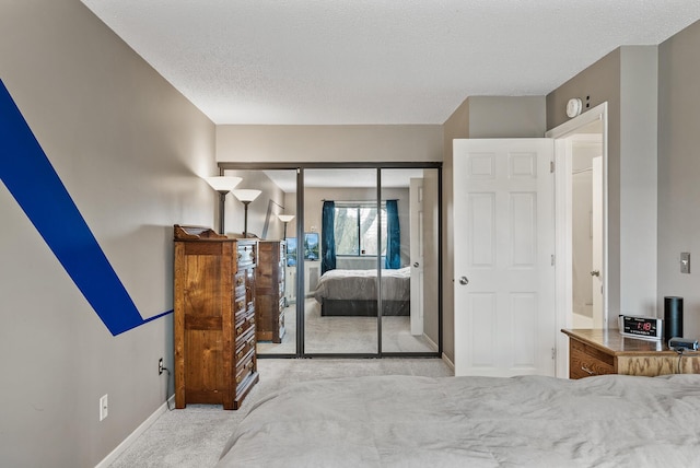 445 Shelard Pkwy Unit 204, Saint Louis Park, MN 55426 - carpeted bedroom with baseboards, a closet, and a textured ceiling