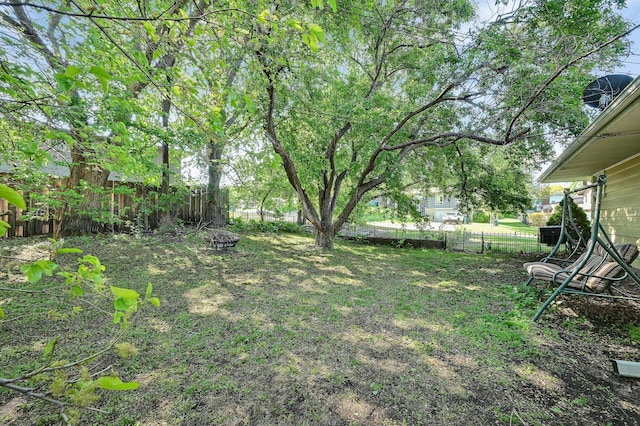 2221 Texas Ave S, Saint Louis Park, MN 55426 - fenced backyard with a fire pit
