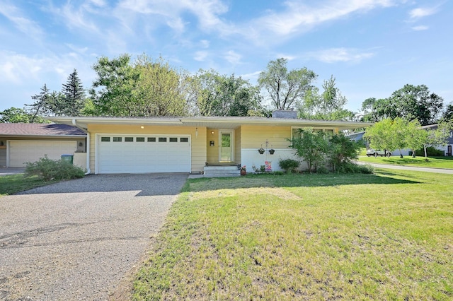 2221 Texas Ave S, Saint Louis Park, MN 55426 - ranch-style house featuring asphalt driveway, an attached garage, and a front lawn