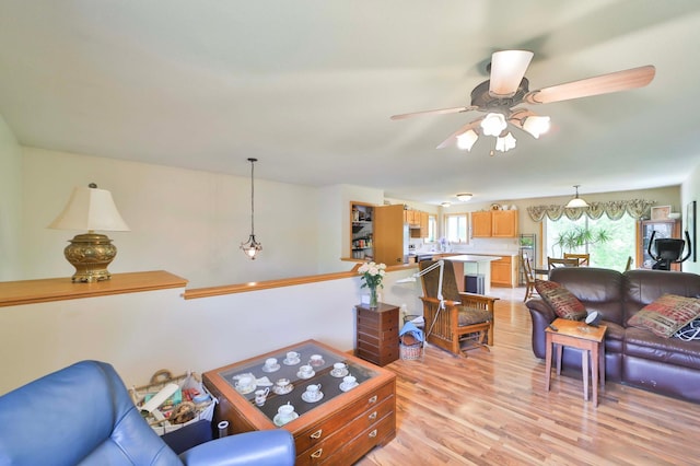9095 Twins St, Brainerd, MN 56401 - living area featuring a ceiling fan, plenty of natural light, and light wood finished floors