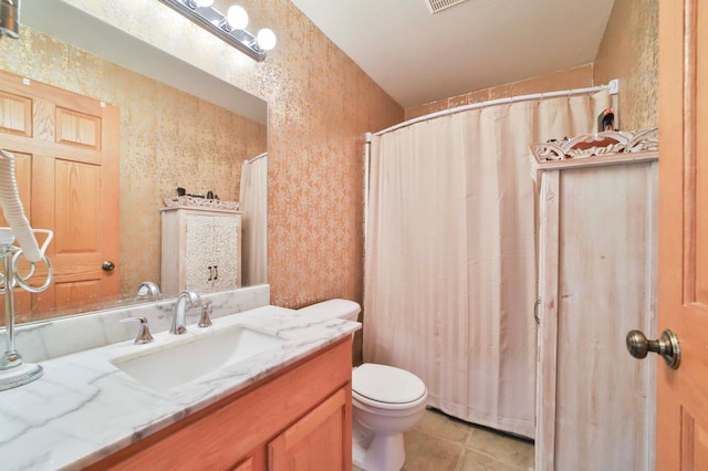 9095 Twins St, Brainerd, MN 56401 - full bathroom with toilet, vanity, tile patterned floors, and curtained shower