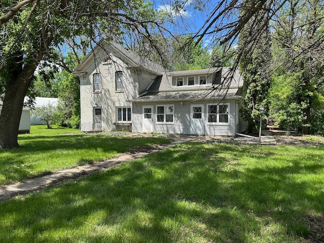 6950 270th St, New Prague, MN 56071 - view of front of house featuring a front yard and roof with shingles