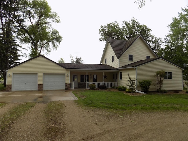 534 200th St, Cedar Twp, MN 56176 - view of front of house featuring driveway, covered porch, a garage, and a front lawn