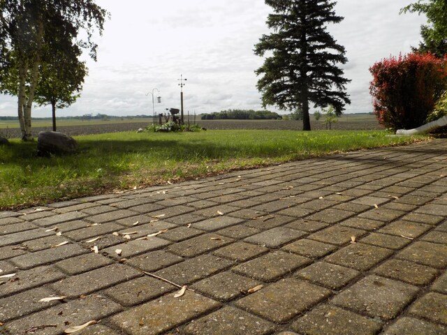 534 200th St, Cedar Twp, MN 56176 - view of patio featuring a view of countryside