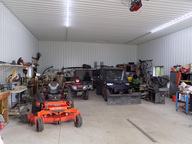 534 200th St, Cedar Twp, MN 56176 - garage with metal wall and a garage door opener