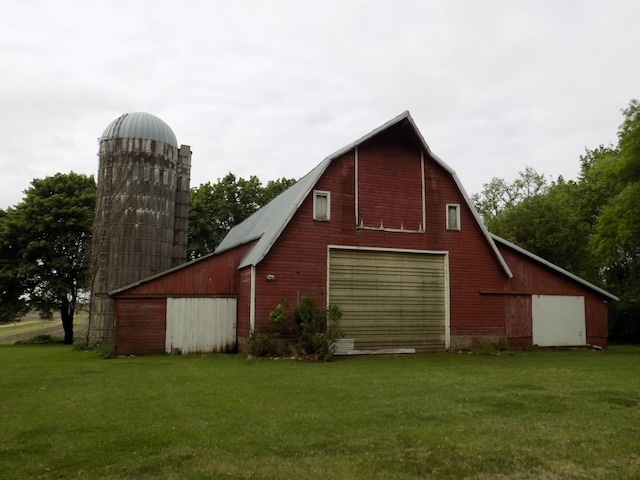534 200th St, Cedar Twp, MN 56176 - view of side of property with a barn, a garage, a lawn, and an outdoor structure