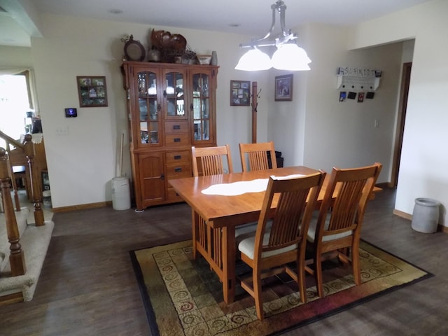 534 200th St, Cedar Twp, MN 56176 - dining area featuring wood finished floors, baseboards, and a chandelier