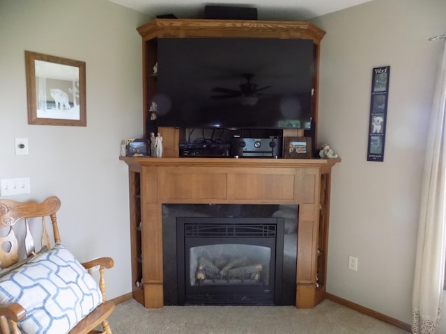 534 200th St, Cedar Twp, MN 56176 - detailed view of a tile fireplace, carpet, ceiling fan, and baseboards
