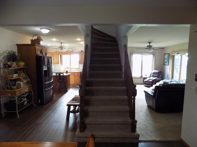 534 200th St, Cedar Twp, MN 56176 - staircase with healthy amount of natural light, wood finished floors, and ceiling fan