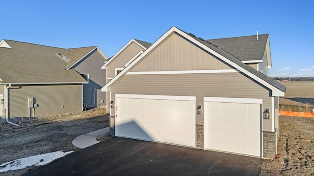 2701 213th St W, Farmington, MN 55024 - garage featuring asphalt driveway