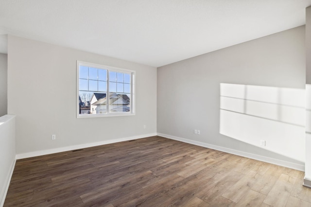2701 213th St W, Farmington, MN 55024 - unfurnished room with wood finished floors and baseboards