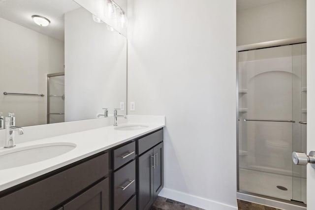 2701 213th St W, Farmington, MN 55024 - full bath featuring a shower stall, double vanity, and baseboards