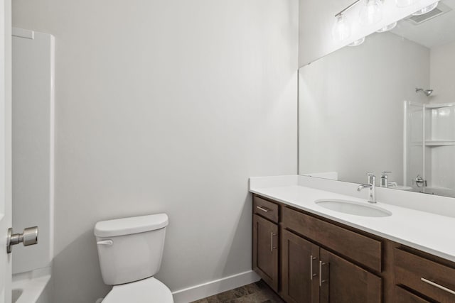 2701 213th St W, Farmington, MN 55024 - full bathroom with vanity, toilet, baseboards, and shower / tub combination