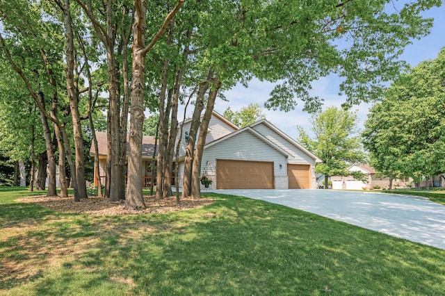 15144 Zilla St NW, Andover, MN 55304 - view of front of house featuring driveway, a front lawn, an attached garage, and brick siding