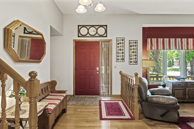 15144 Zilla St NW, Andover, MN 55304 - entrance foyer with wood finished floors, a chandelier, and stairs
