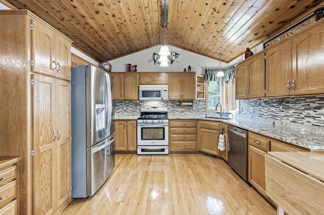 15144 Zilla St NW, Andover, MN 55304 - kitchen featuring stainless steel appliances, a sink, lofted ceiling, light wood-type flooring, and open shelves