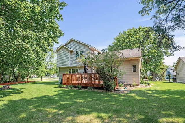 15144 Zilla St NW, Andover, MN 55304 - back of house featuring a deck and a lawn
