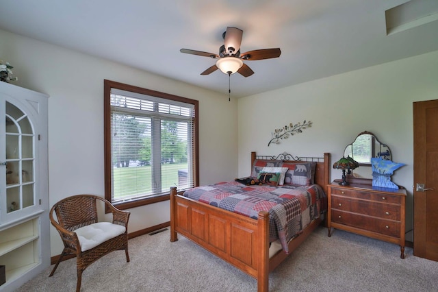 23369 330th St, Sebeka, MN 56477 - bedroom with light carpet, ceiling fan, and baseboards