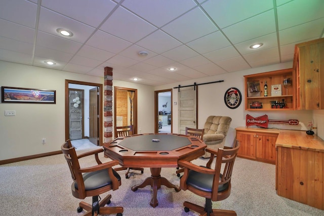 23369 330th St, Sebeka, MN 56477 - playroom featuring a barn door, light carpet, a drop ceiling, baseboards, and recessed lighting