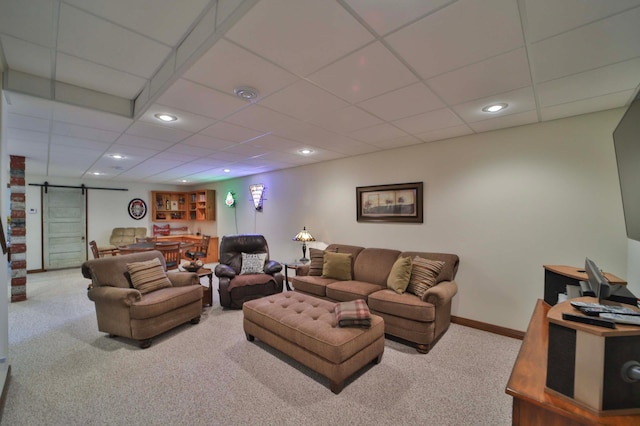 23369 330th St, Sebeka, MN 56477 - living area featuring carpet floors, a barn door, a paneled ceiling, recessed lighting, and baseboards