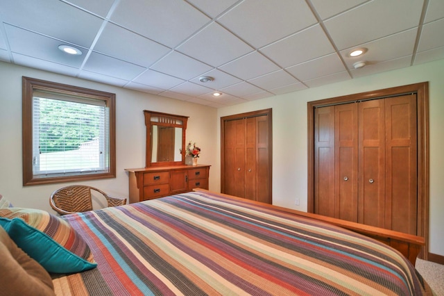 23369 330th St, Sebeka, MN 56477 - bedroom with multiple closets, a paneled ceiling, and recessed lighting