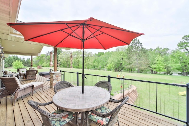 23369 330th St, Sebeka, MN 56477 - deck featuring a yard, outdoor dining area, and view of wooded area