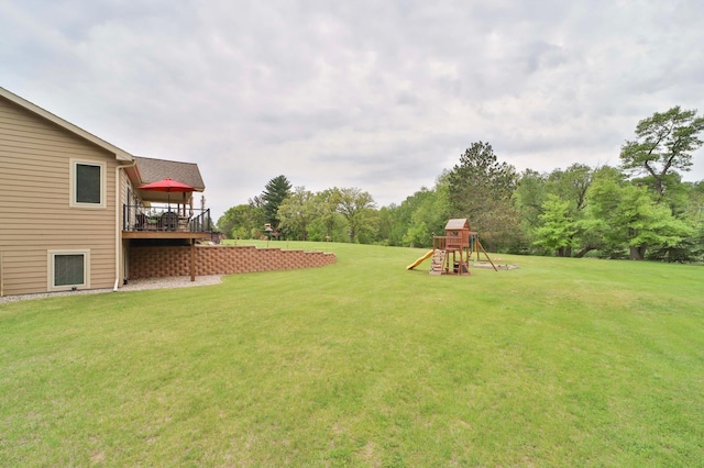 23369 330th St, Sebeka, MN 56477 - view of grassy yard featuring a playground and a deck