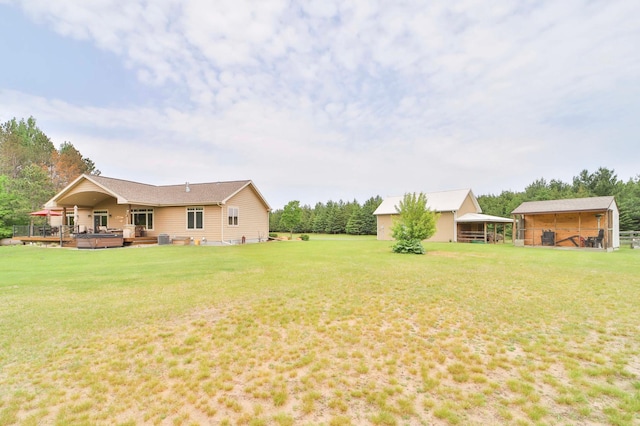 23369 330th St, Sebeka, MN 56477 - view of green lawn featuring a hot tub and central AC unit