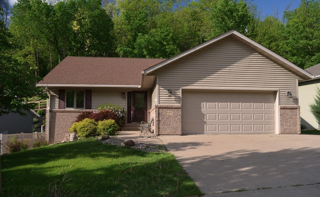 668 Hallstrom Dr, Red Wing, MN 55066 - ranch-style home featuring brick siding, an attached garage, driveway, and a front lawn