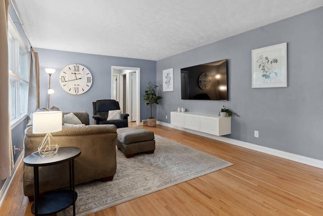 3732 Jersey Ave N, Crystal, MN 55427 - living area featuring baseboards and wood finished floors