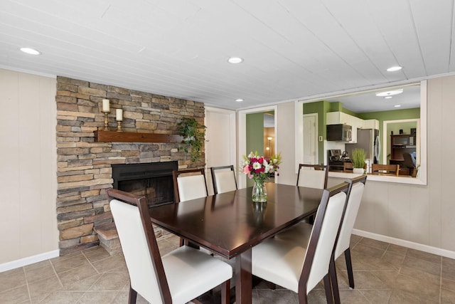 3732 Jersey Ave N, Crystal, MN 55427 - dining area featuring light tile patterned flooring, recessed lighting, and a stone fireplace