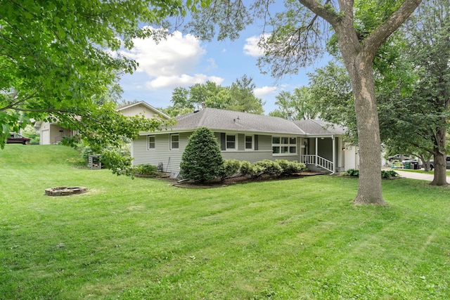 3732 Jersey Ave N, Crystal, MN 55427 - back of house with a fire pit and a yard