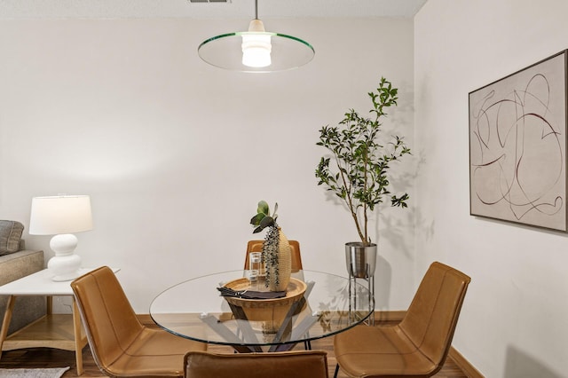 2566 Ellis Ave Unit 124, Saint Paul, MN 55114 - dining area with wood finished floors and baseboards
