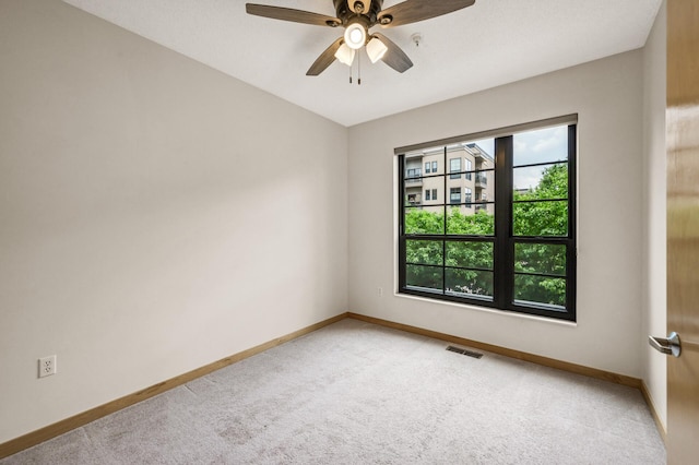 2566 Ellis Ave Unit 124, Saint Paul, MN 55114 - empty room with light carpet, baseboards, and a ceiling fan