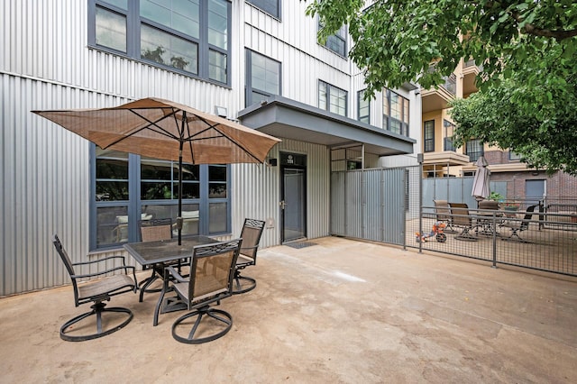 2566 Ellis Ave Unit 124, Saint Paul, MN 55114 - view of patio featuring outdoor dining space
