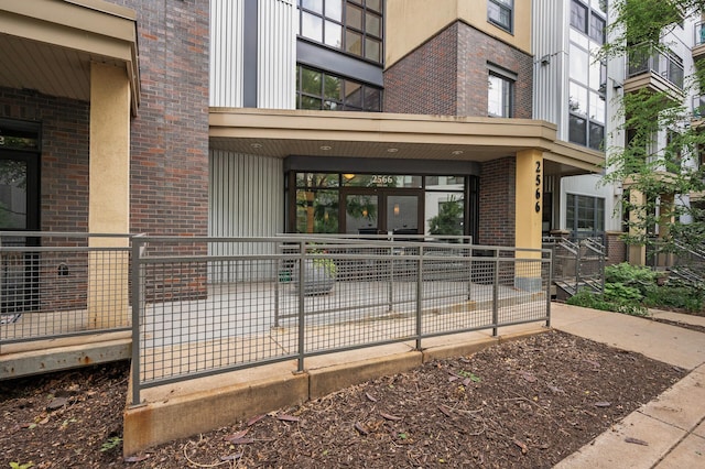 2566 Ellis Ave Unit 124, Saint Paul, MN 55114 - doorway to property with brick siding and a patio
