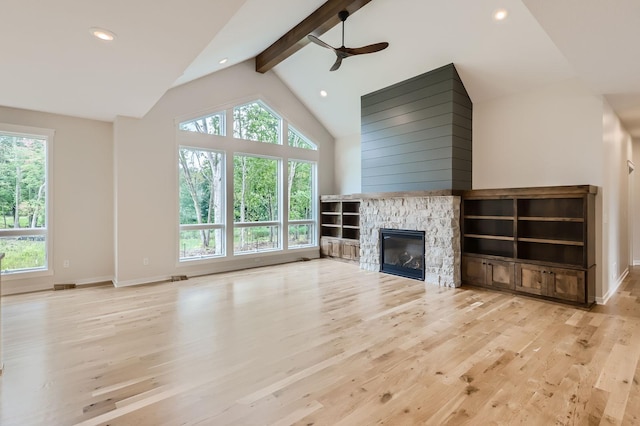 18022 Urbank St NE, Ham Lake, MN 55304 - unfurnished living room with wood finished floors, baseboards, beamed ceiling, a ceiling fan, and high vaulted ceiling