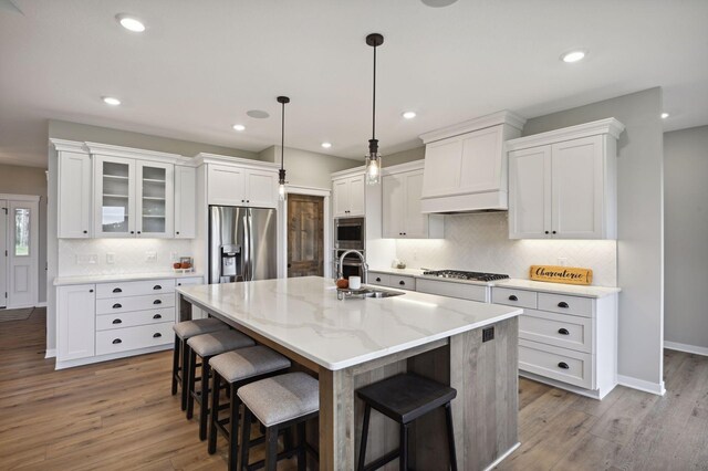 18022 Urbank St NE, Ham Lake, MN 55304 - kitchen with stainless steel appliances, a sink, premium range hood, white cabinetry, and recessed lighting
