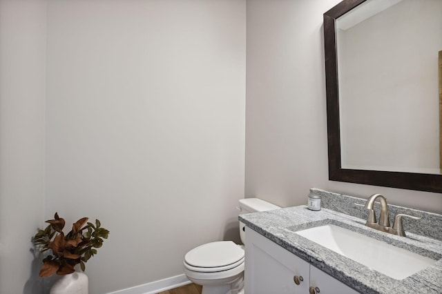 18022 Urbank St NE, Ham Lake, MN 55304 - half bathroom with toilet, vanity, and wood finished floors